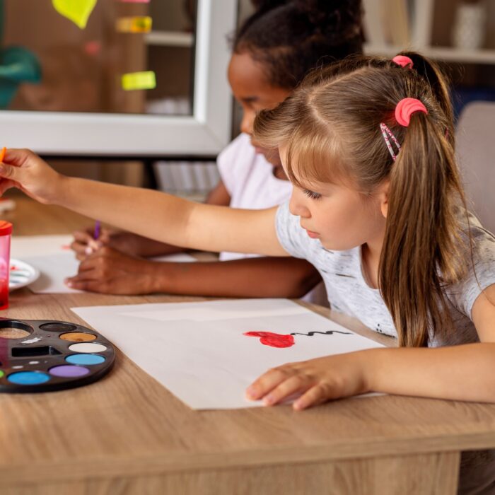 Children doing art class at home